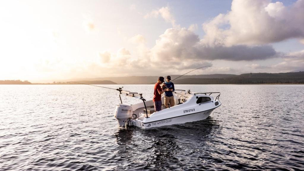 Fighting a Garrick on Swartvlei ariel shot guide and angler
