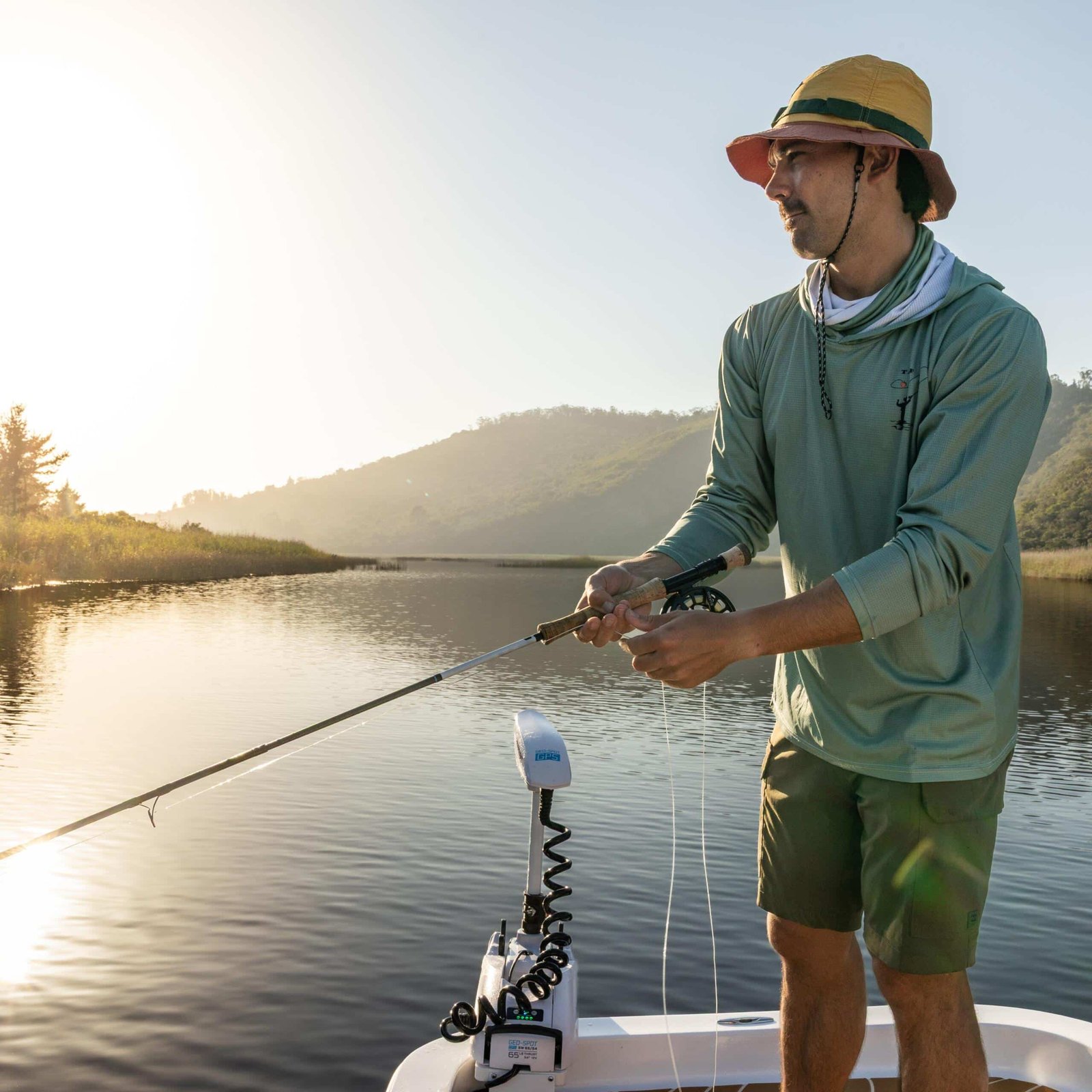 Fly fisher sight-fishing the shallow flats of the Swartvlei estuary